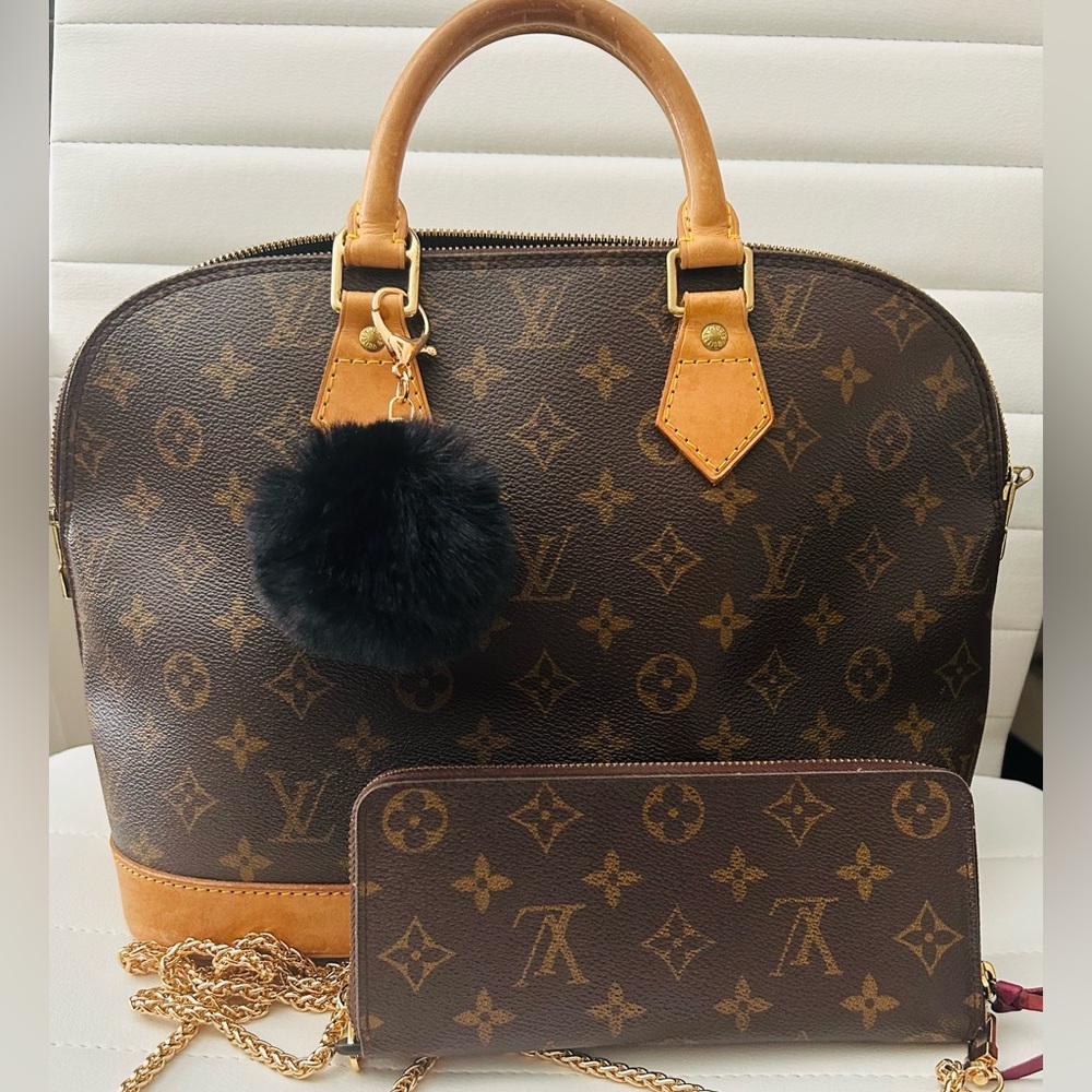 Louis Vuitton Alma bag and Clemence wallet